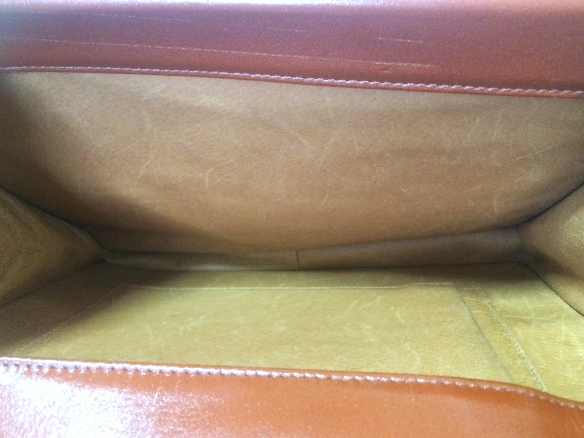 Vintage MCM brown monogram shoulder bag with leather straps and golden star shape logo motif closure. Designed by Michael Cromer. 060621r1